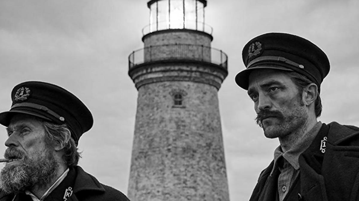 Wake (Willem Dafoe, left) and Winslow (Robert Pattinson) are lonely keepers of the flame in Robert Eggers' The Lighthouse.
