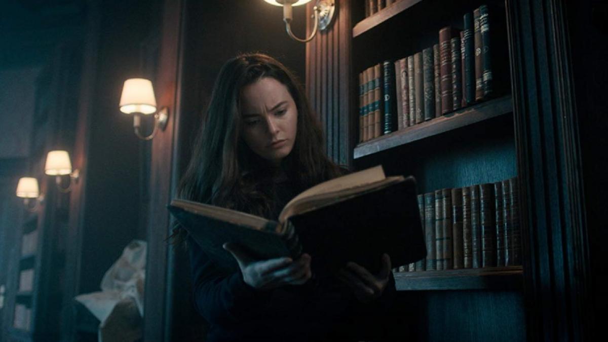 Violinist Rose Fisher (Freya Tingley) peruses one of her late father's books while searching for answers in Andrew Desmond's 'The Sonata'.