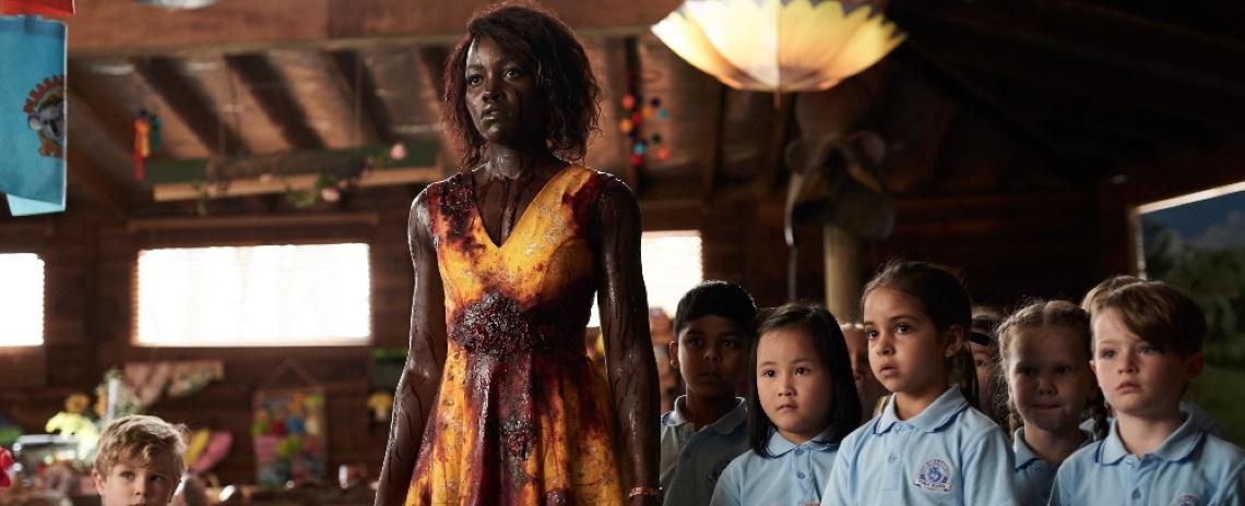 Miss Caroline (Lupita Nyong'o) faces a very kid-unfriendly threat in Little Monsters.